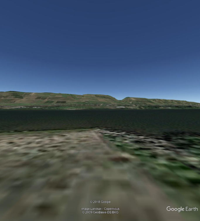 Image from Google Earth. Note notch in hills similar to Photo 142